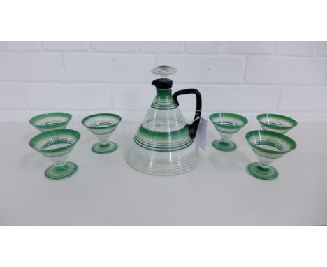 An Art Deco decanter and set of six glasses, each with green, white and black vertical striped decoration (7) 
