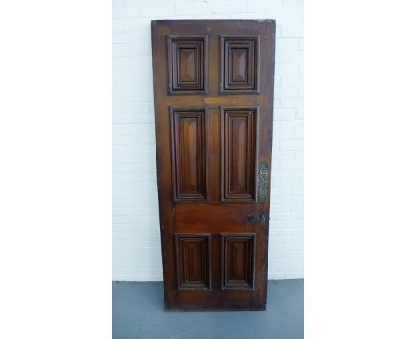 Architectural Salvage - A Georgian stained pine panel door having finger plates and locks, 