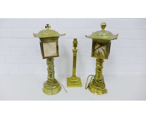 A pair of contemporary brass lantern style table lamps each with dragon and pearl of wisdom pattern in relief together with a