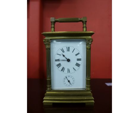 A 19th Century brass alarm carriage clock, in original leather case, possibly by L&F Moreau