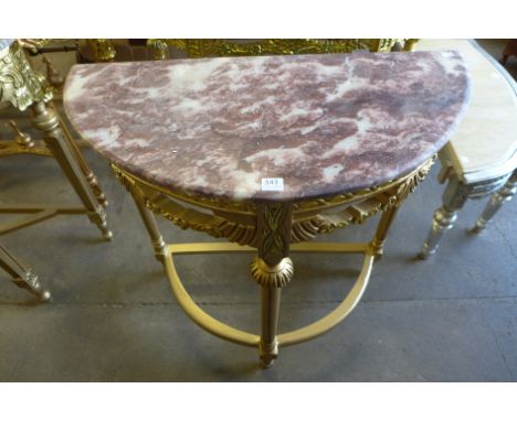 A reproduction French Louis XV style gilt console table