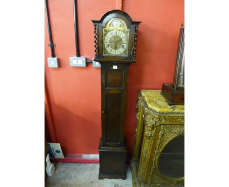 An oak dwarf longcase clock