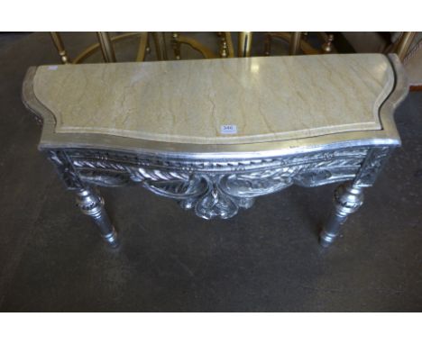 A reproduction French Louis XV style silvered console table