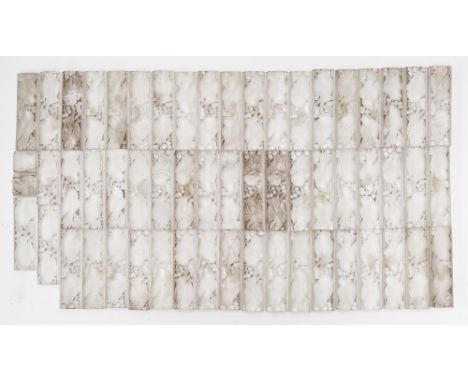 A GROUP OF CLEAR AND FROSTED GLASS SMALL RECTANGULAR TILES (58)Probably Lalique, 20th century Each of the fifty-five moulded 