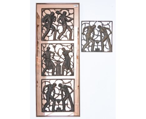 A SET OF IRONWORK PLAQUES ON A MIRRORED BACK (2)The three opework panels mounted on a rose gold tinted mirrored framed panel,