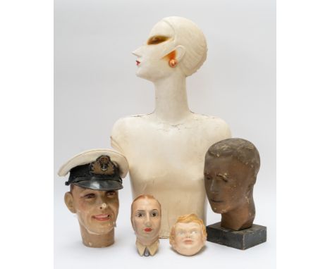 AN ART DECO PLASTER SIDE PROFILE BUST OF A LADY AND FOUR OTHER HEADS (5)74cm high; Including three papier-mache heads, one of