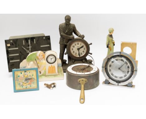 A GROUP OF TIMEPIECES INCLUDING A FIGURAL CLOCK OF A MAN STEERING A SHIP (7)The dial inscribed ‘United Electric’, 39cm high; 