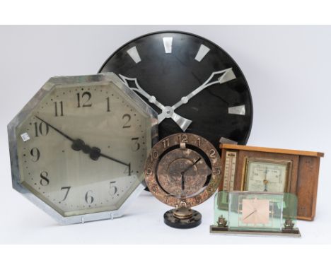 A GROUP OF CLOCKS INCLUDING A SILVER-PLATED CIRCULAR MANEL CLOCK (5)24cm high; Together with two wall clocks, a desk clock an