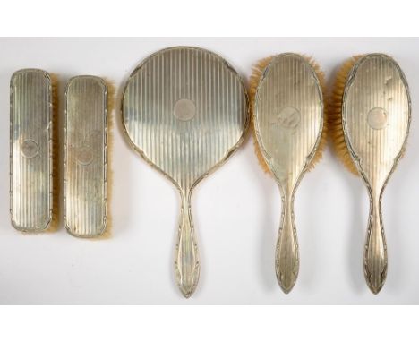 A GEORGE V FIVE PIECE SILVER BRUSH SET, ENGINE TURNED, BIRMINGHAM 1915