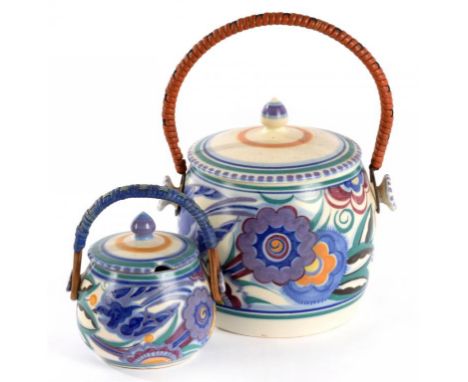 A POOLE POTTERY RED BODIED EARTHENWARE PRESERVE POT AND COVER AND A POOLE POTTERY WHITE BODIED EARTHENWARE BISCUIT BARREL AND