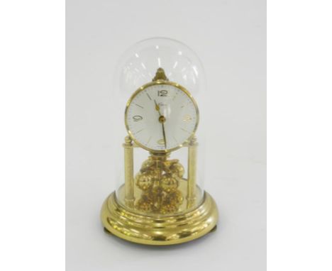 A GERMAN ANNIVERSARY CLOCK BENEATH GLASS DOME, 22CM H