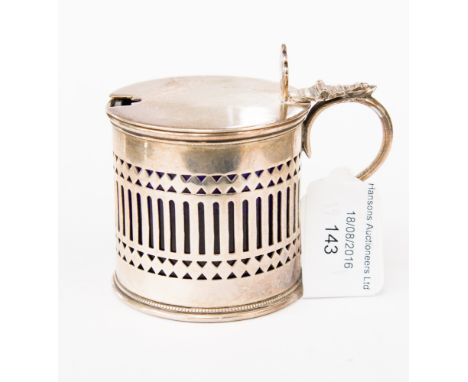 An early 20th Century silver drum mustard with liner, with pierced fretwork decoration and pierced fan shape finial, maker St