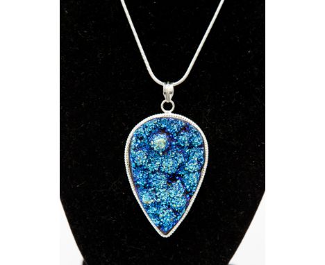 A titanium druzy pendant necklace, set in a 925 silver mount, in the form of a spade, fitted on a silver snake link chain