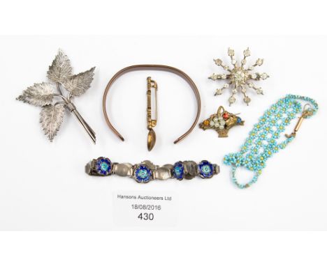 A white metal and enamel bracelet with Arts and Crafts style detail workmanship, a gold clasped beadwork necklace, an anointi