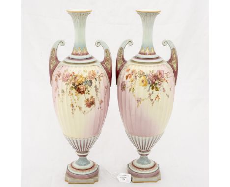 A pair of Royal Worcester vases, 1895, fluted Grecian urn form with batwing handles, glazed in pink and grey blue, decorated 