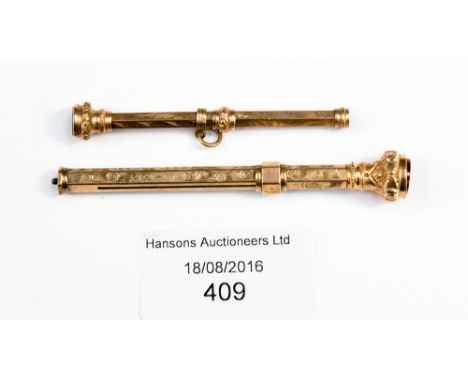 Two 9 ct gold propelling pencils, each set  with a hardstone finial, engraved with foliate decoration (2)