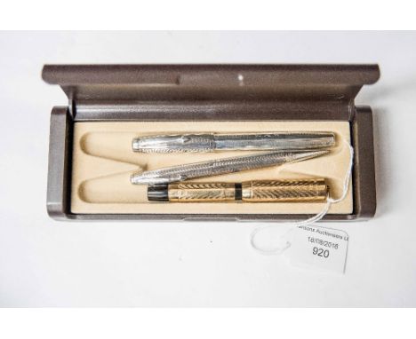 A Swan silver fountain pen and pencil set, level filler, engine turned case with 14 ct gold nib, together with a 1920s Morris