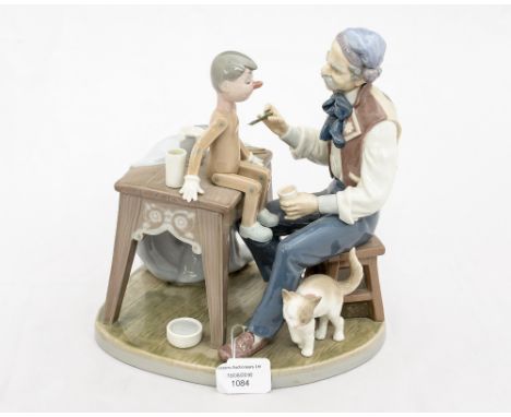 A Lladro figure of Guiseppe painting Pinnochio