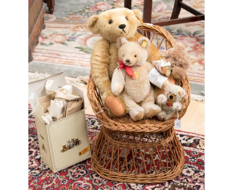 Four Steiff teddy bears, together with a wicker chair, with carrier bags and catalogue 