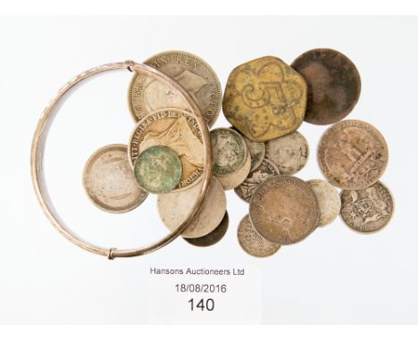A quantity of silver coins (worn) and a halfcrown, together with George II halfpenny and a Billingsgate 5 schilling token, an