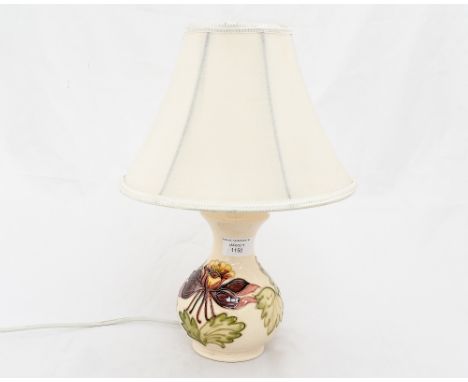 A Moorcroft lamp base with original Moorcroft shade cream ground 'Orchid' pattern