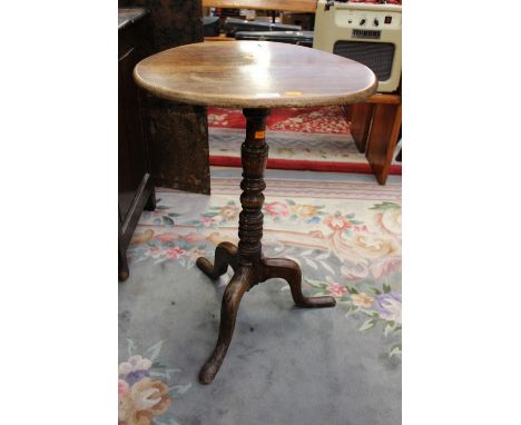 A 19th Century oak tripod table, raised on cabriole legs