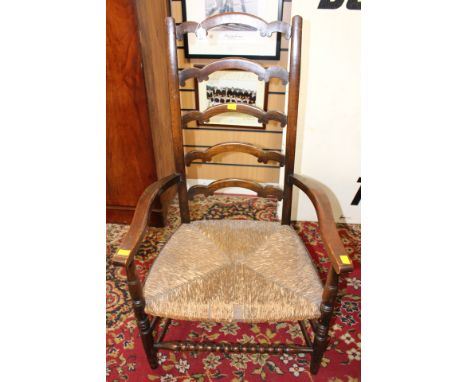 An early 20th Century rush seated ladder back chair
