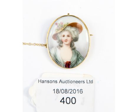 An 18 ct gold and porcelain brooch pendant with portrait of a shepherdess 