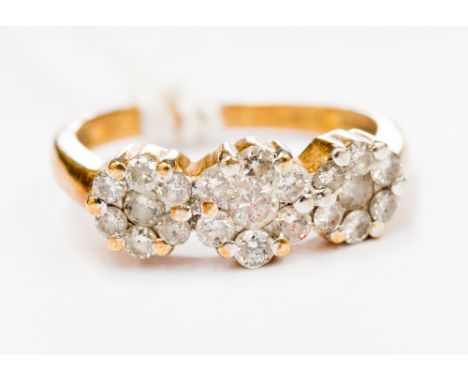 An 18 ct yellow gold and diamond cluster ring, claw set diamonds approx. 0.75 ct, size K 