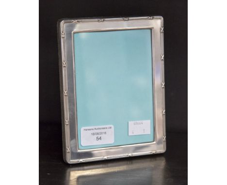 A silver easel photograph frame, hallmark London 1995