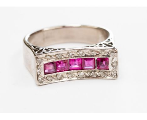 A ruby and diamond ring, having central row of five calibre cut rubies within rectangular diamond set mount, white metal unma