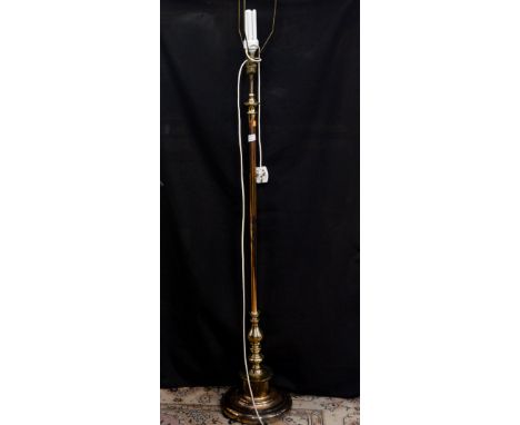 A modern brass finish standard lamp