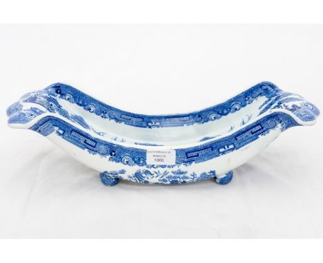A 19th Century Staffordshire blue and white stilton trough, willow pattern, on ball feet