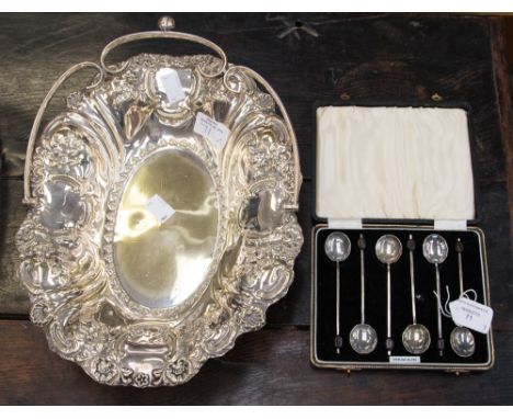 A boxed set of sterling silver bean finial coffee spoons, Birmingham 1938, hammered  bowl, decagon shape, and an EPNS fruit b
