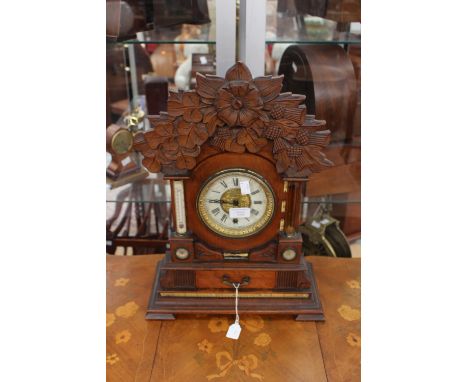 A Victorian oak-cased bracket clock, United Clock Company, standing approx 51 cm high, carved rose, thistle and shamrock pedi