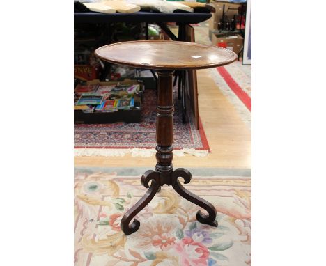 An early 19th Century oak tripod wine table