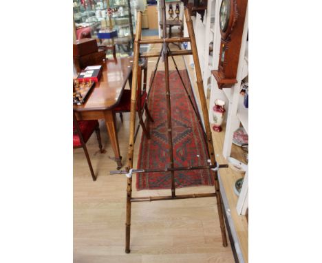 A late 19th Century bamboo easel, with an adjustable support 150 cm high 