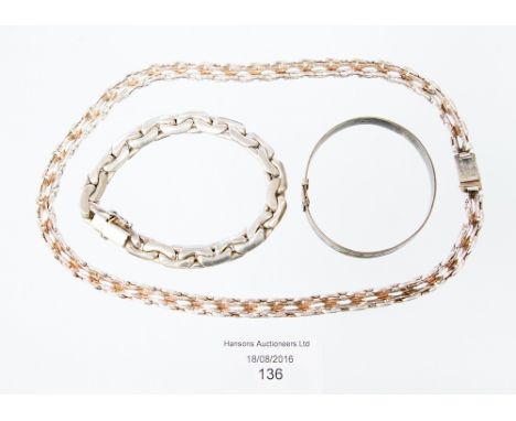 A silver necklace and a silver link bracelet 84.4 grm / 2.7 ozt approx. to include a bangle 