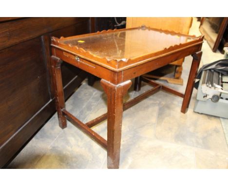 A George III style mahogany coffee table, in the manner of Thomas Chippendale, the top with a glass surface and having a gall