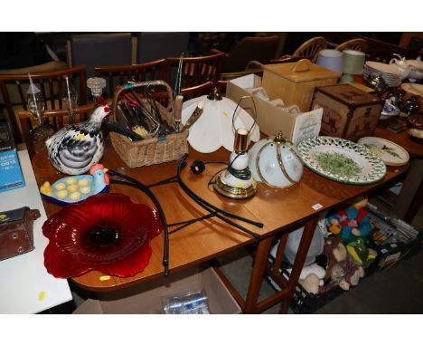 A graduated set of boxes; a wooden bread board; table lamp; various shades; a wall clock; Portuguese pottery wall plate; glas