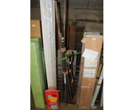 A quantity of long handled garden tools to include rake, digging fork, spade etc 