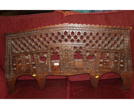 An Eastern carved wooden panel 