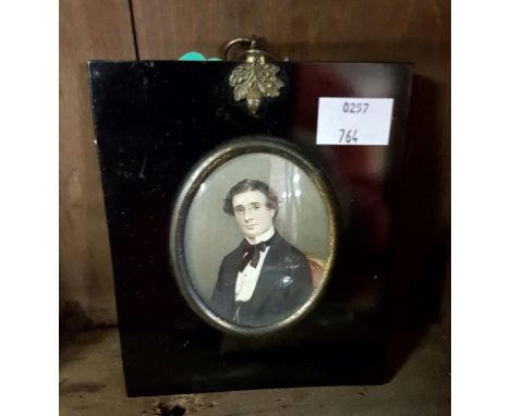 NINETEENTH CENTURY ANGLO-IRISH SCHOOL, oval miniature portrait of a gentleman wearing black bow tie, black jacket, with silve