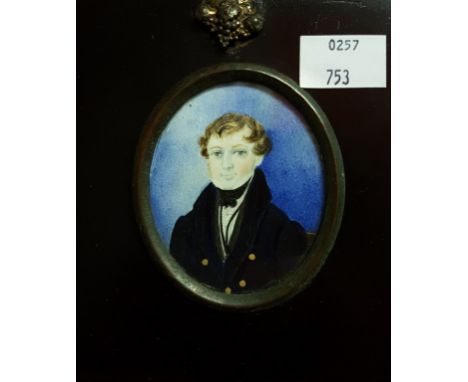 NINETEENTH CENTURY IRISH SCHOOL, oval miniature portrait of a gentleman, wearing a black jacket and black bow tie, on ivory, 