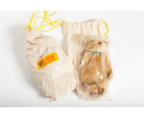 A PAIR OF STEIFF MILLENNIUM BEARS, button in ear, each in original packaging. (2)  