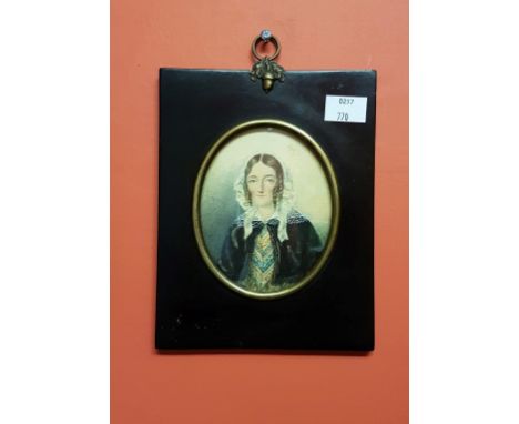 NINETEENTH CENTURY ENGLISH SCHOOL, oval miniature portrait of a woman wearing a lace bonnet with blue ribbon, W.C. on card, 3