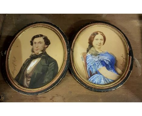 MAYER C. 1878, oval miniature portrait of a lady wearing a blue dress, seated  in a red chair, and her companion, a gentleman