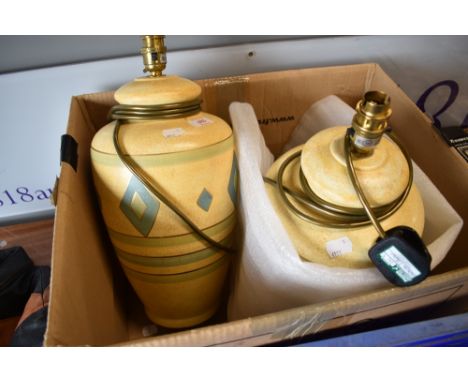 A pair of modern table lamps having decorated ceramic bodies