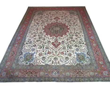 FINE PART SILK TABRIZ CARPET, 415cm x 300cm, terracotta pendant medallion on an ivory field of scrolling vines and palmettes 