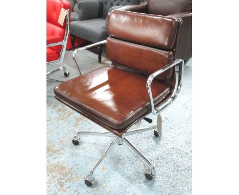 REVOLVING DESK CHAIR, Charles Eames design tan brown leather the seat revolving and reclining on an adjustable base with cast